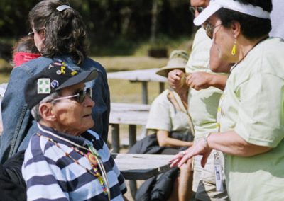 A women (right) speaking to an Elder man (left) at the Run to the Rogue event